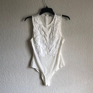 Off white see through bodysuit with flower details in the front